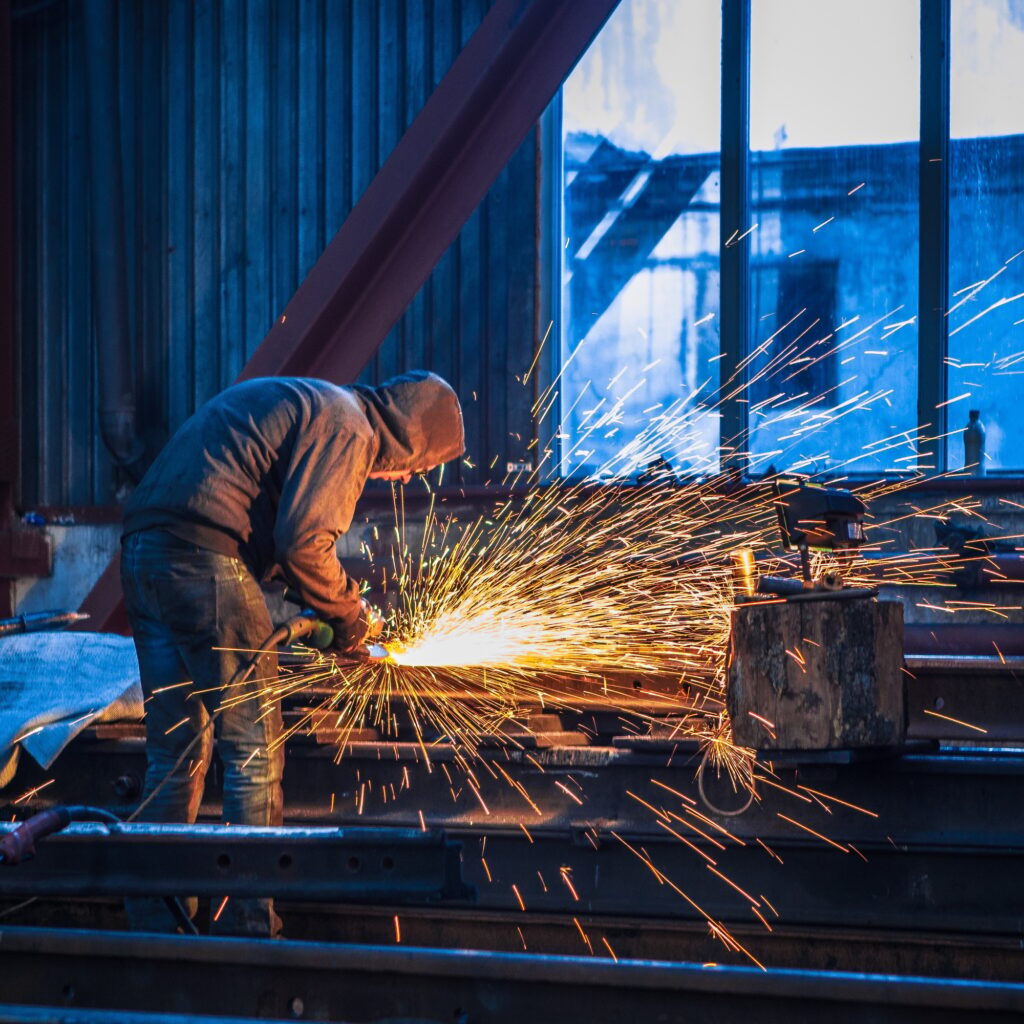 Manufacturing. locksmith works at factory with sparks